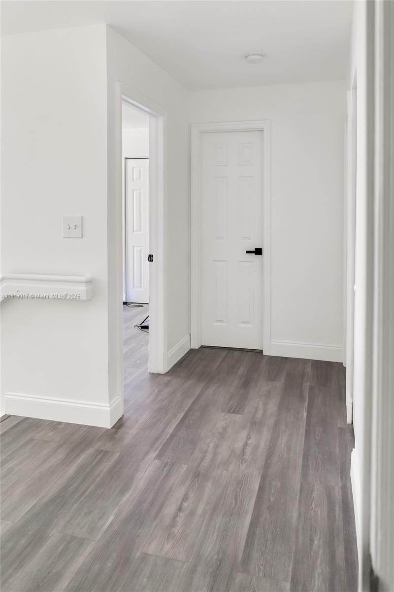 15309 Southwest 183rd Terrace Miami, FL 33187 - Photo 19 of 30 a view of a room with wooden floor