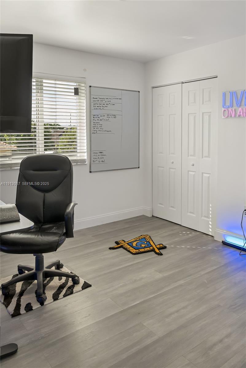 15309 Southwest 183rd Terrace Miami, FL 33187 - Photo 20 of 30 a room with furniture and a flat screen tv