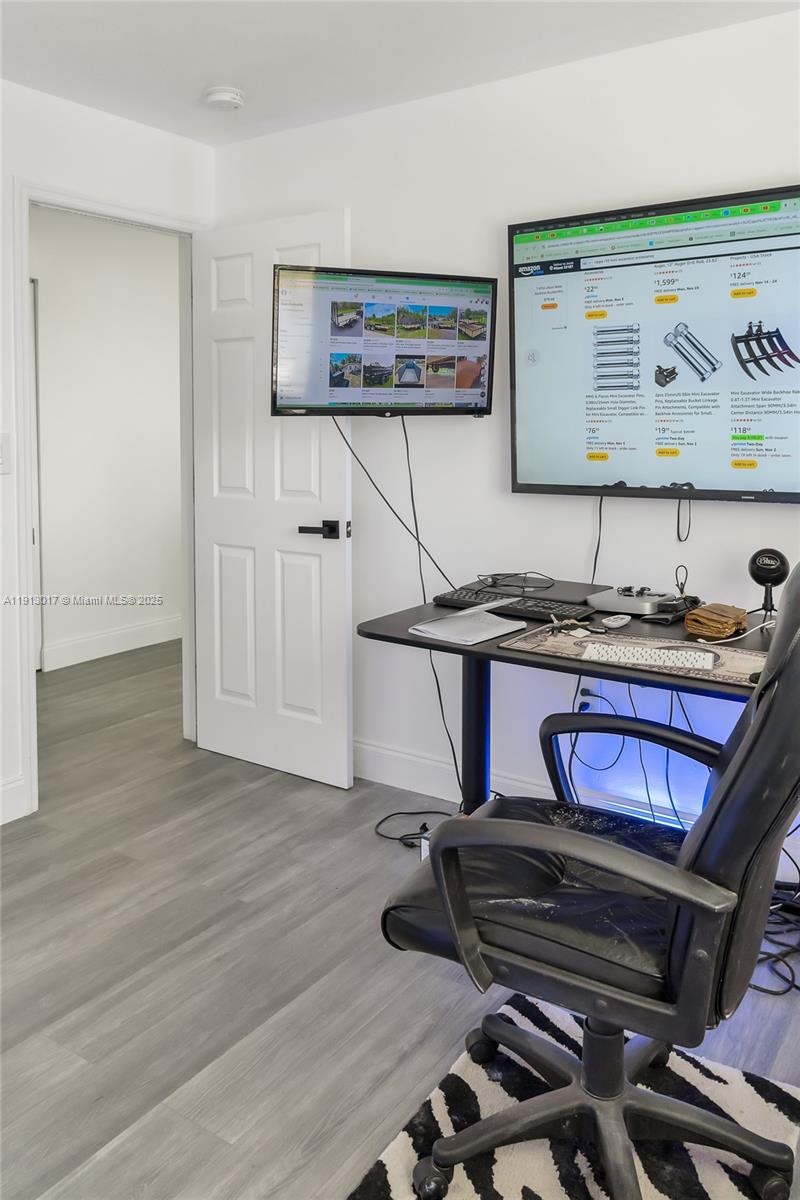 15309 Southwest 183rd Terrace Miami, FL 33187 - Photo 21 of 30 a kitchen with a stove and cabinets