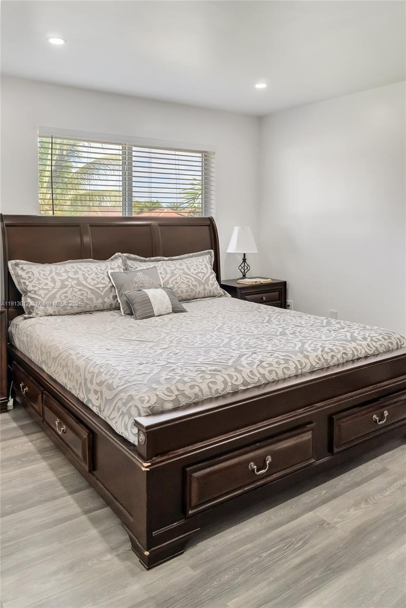 15309 Southwest 183rd Terrace Miami, FL 33187 - Photo 27 of 30 a living room with granite countertop furniture and a couch