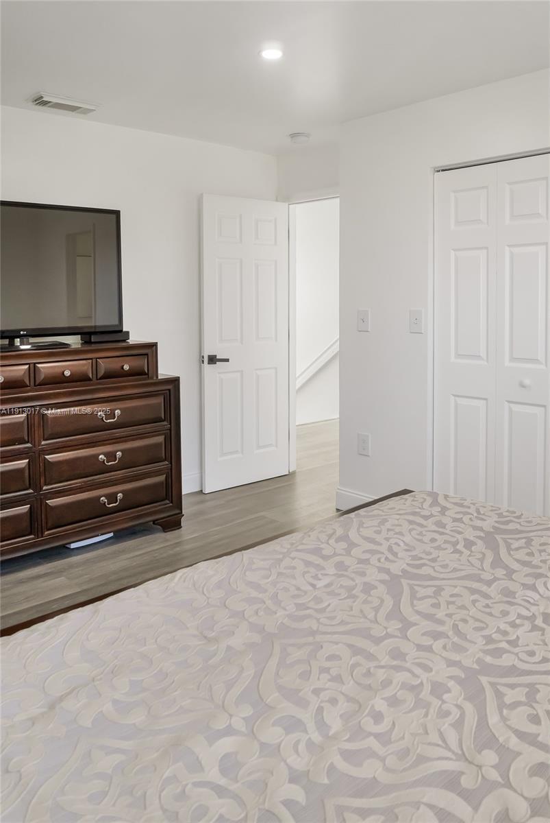 15309 Southwest 183rd Terrace Miami, FL 33187 - Photo 28 of 30 a view of room with cabinet and flat screen tv