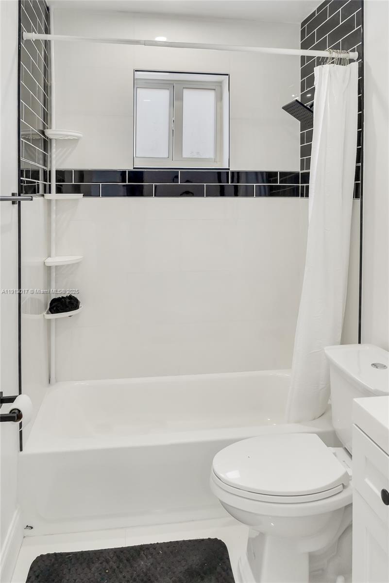 15309 Southwest 183rd Terrace Miami, FL 33187 - Photo 29 of 30 a bathroom with a toilet and a bathtub