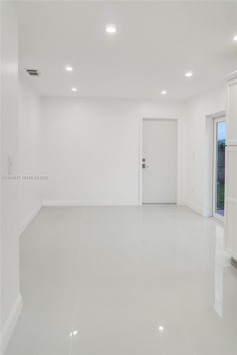15309 Southwest 183rd Terrace Miami, FL 33187 - Photo 9 of 30 an empty room with a empty space
