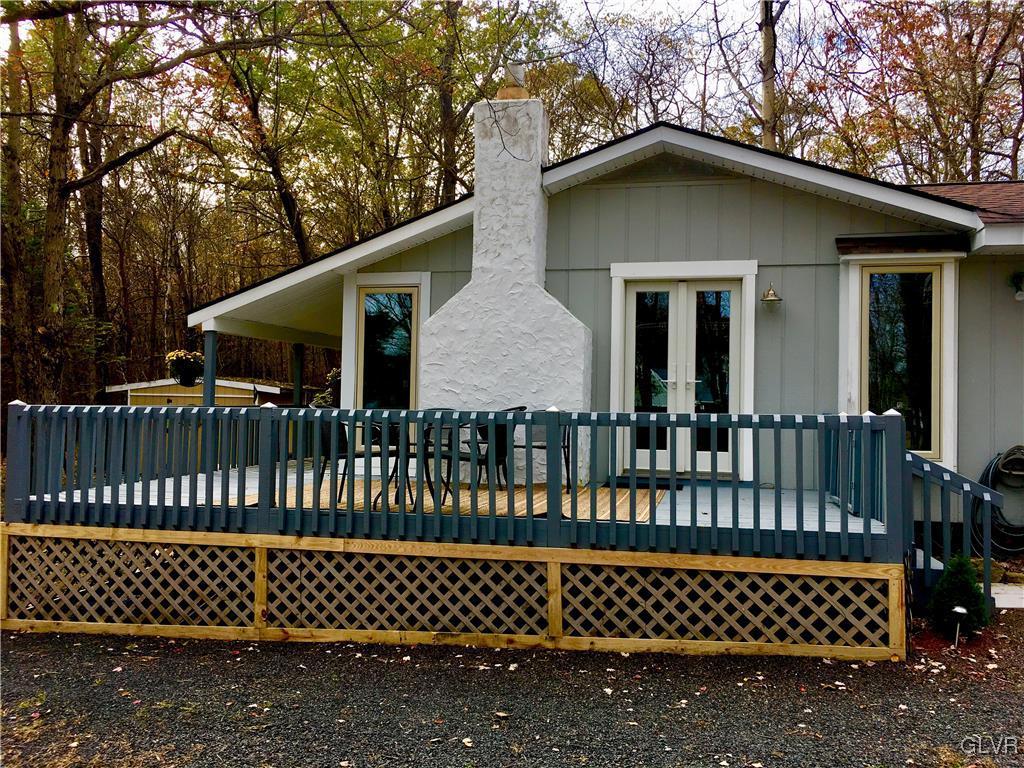 a front view of a house with a deck