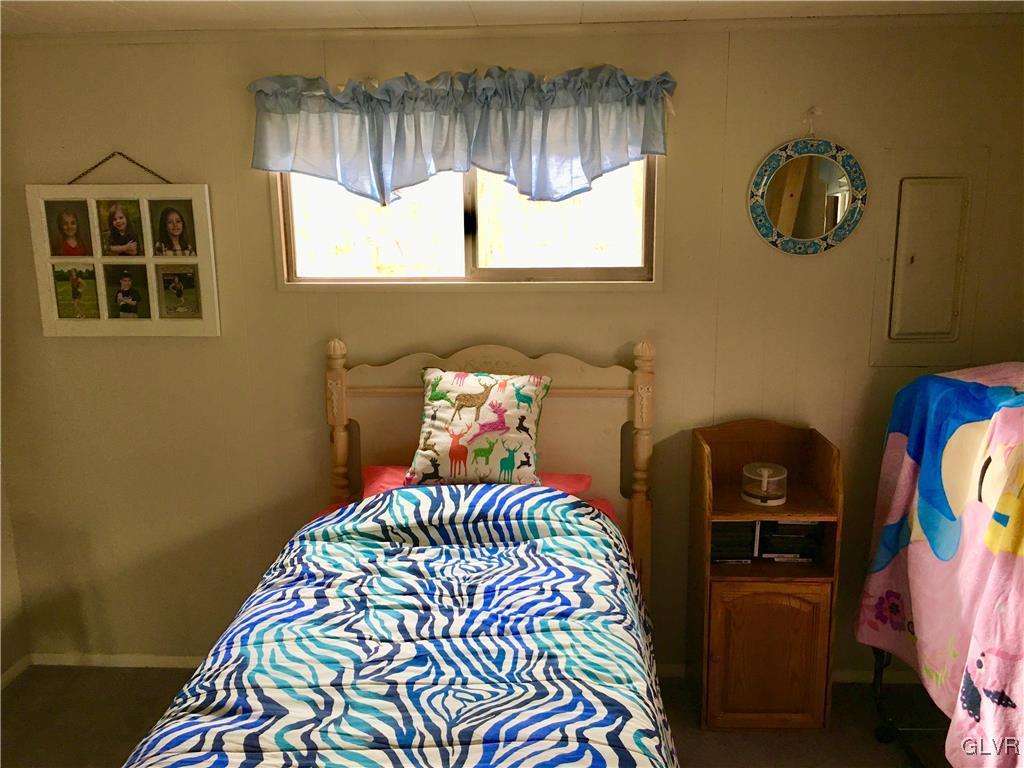 354 Tower Road Albrightsville, PA 18210 - Photo 3 of 26 a bedroom with a bed and a window