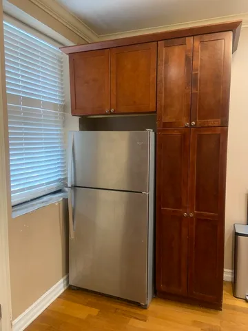 a view of a refrigerator in kitchen