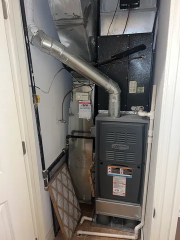 a room with water heater and car