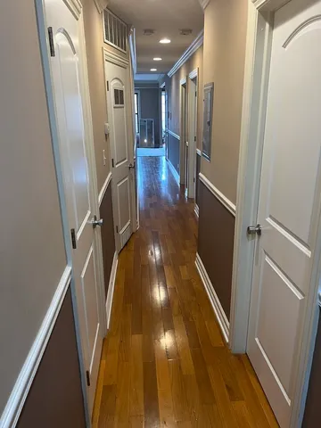 a view of entryway with wooden floor
