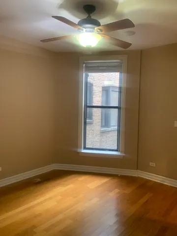 an empty room with a empty space and windows