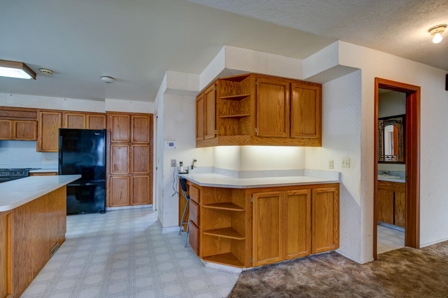 11120 Courier Road Plymouth, CA 95669 - Photo 12 of 73 a kitchen with a stove and a refrigerator