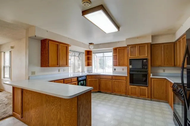 a bathroom with a sink a mirror and a window