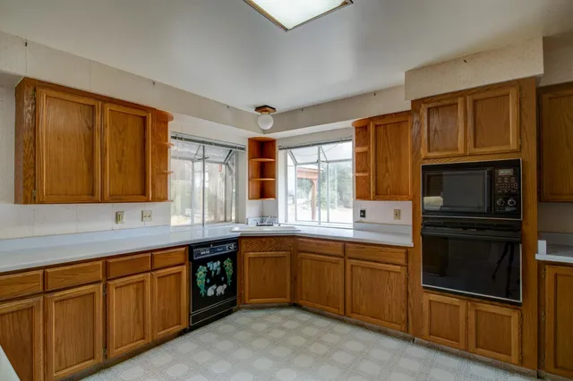 a view of a hallway with a door and a window