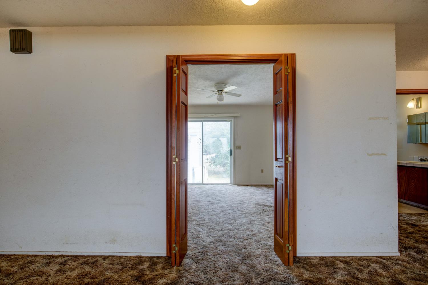 11120 Courier Road Plymouth, CA 95669 - Photo 20 of 73 a view of a hallway with a door and a window