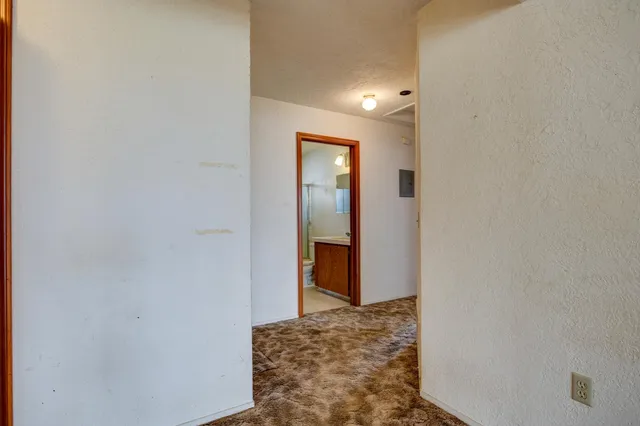 a bathroom with a sink toilet and window