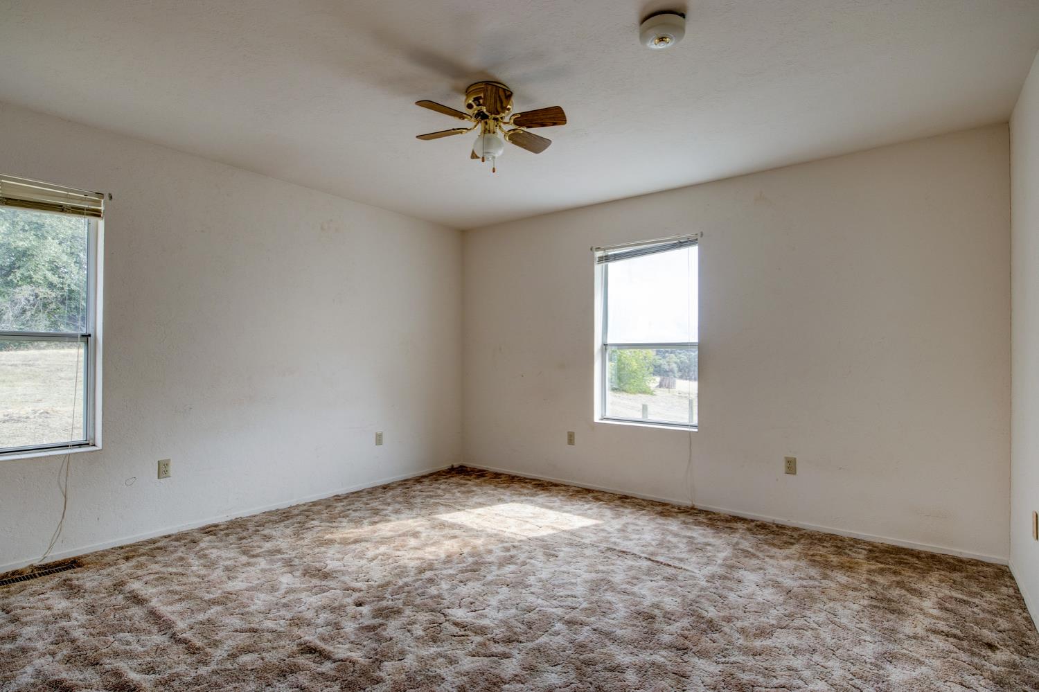 11120 Courier Road Plymouth, CA 95669 - Photo 25 of 73 a view of empty room with windows