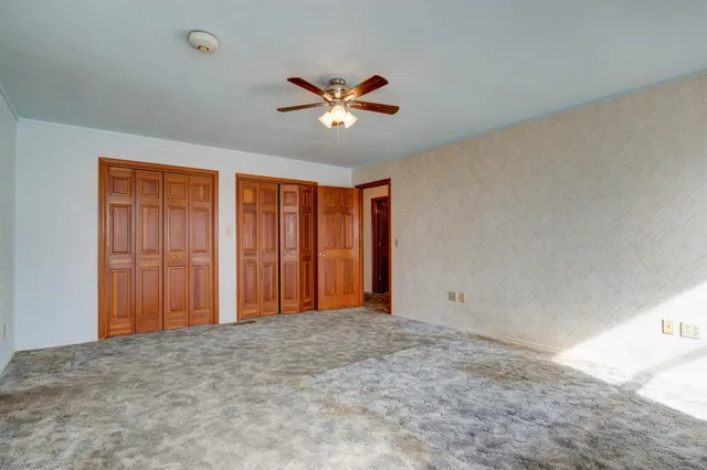 a view of yard with swimming pool and green space