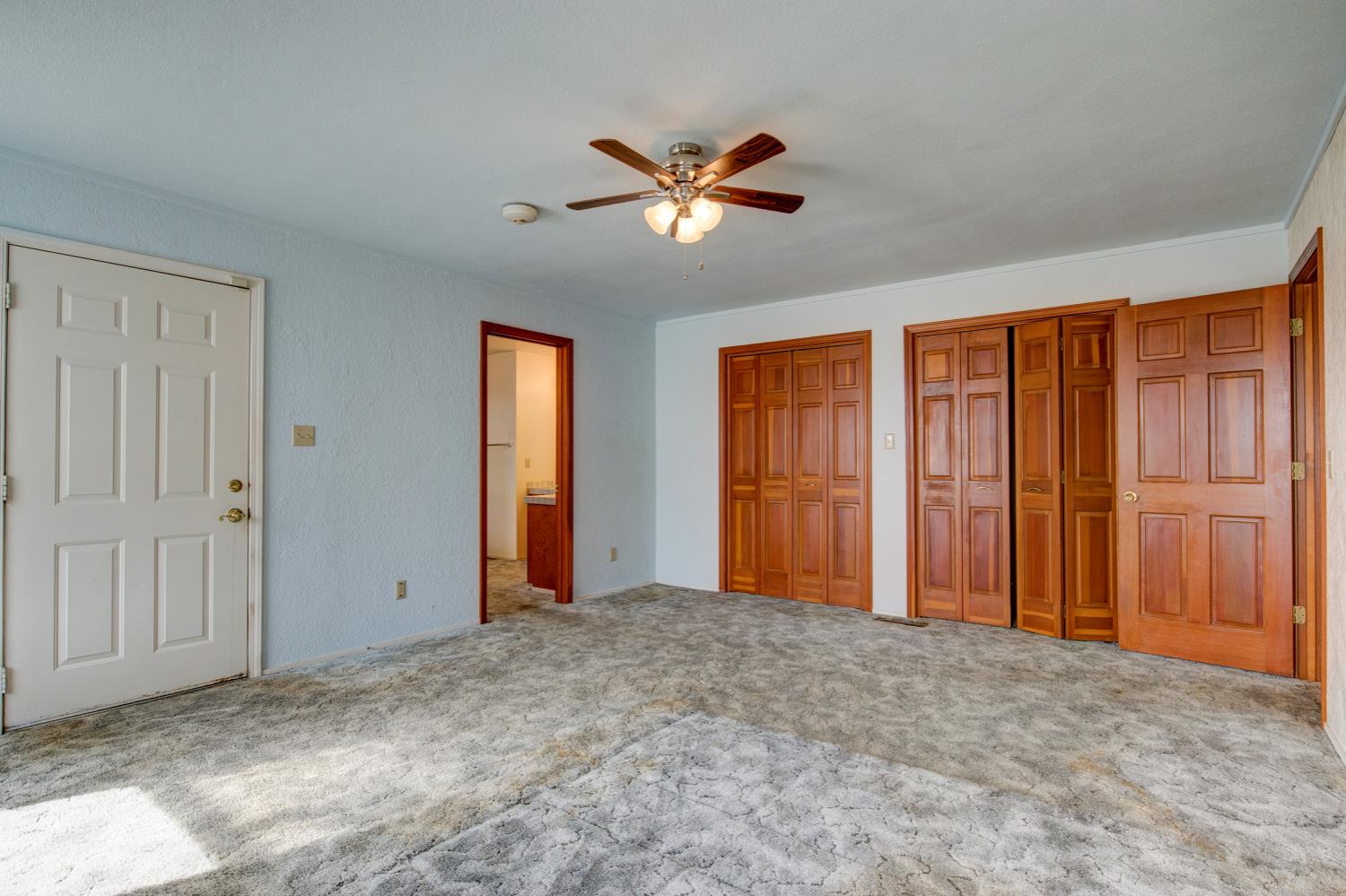 11120 Courier Road Plymouth, CA 95669 - Photo 29 of 73 a view of empty room with window and ceiling fan