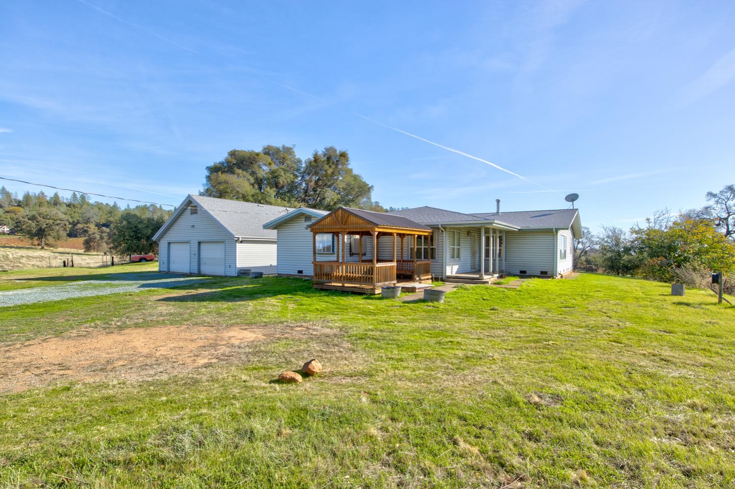 11120 Courier Road Plymouth, CA 95669 - Photo 32 of 73 a house with swimming pool in front of it