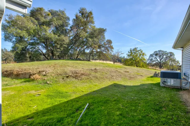a view of a backyard of a house