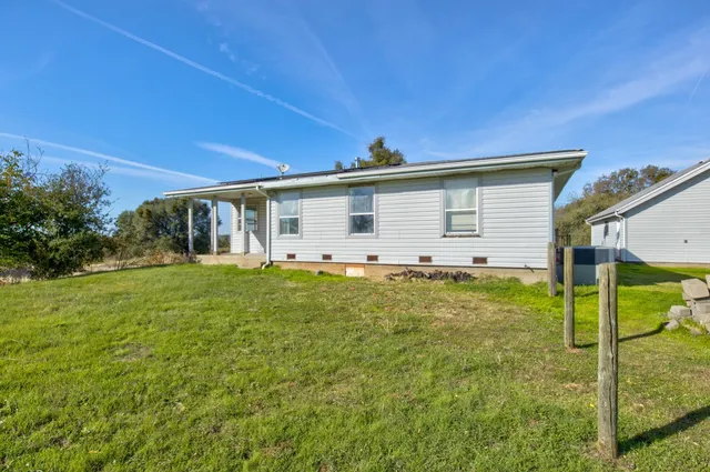 a view of a backyard of a house
