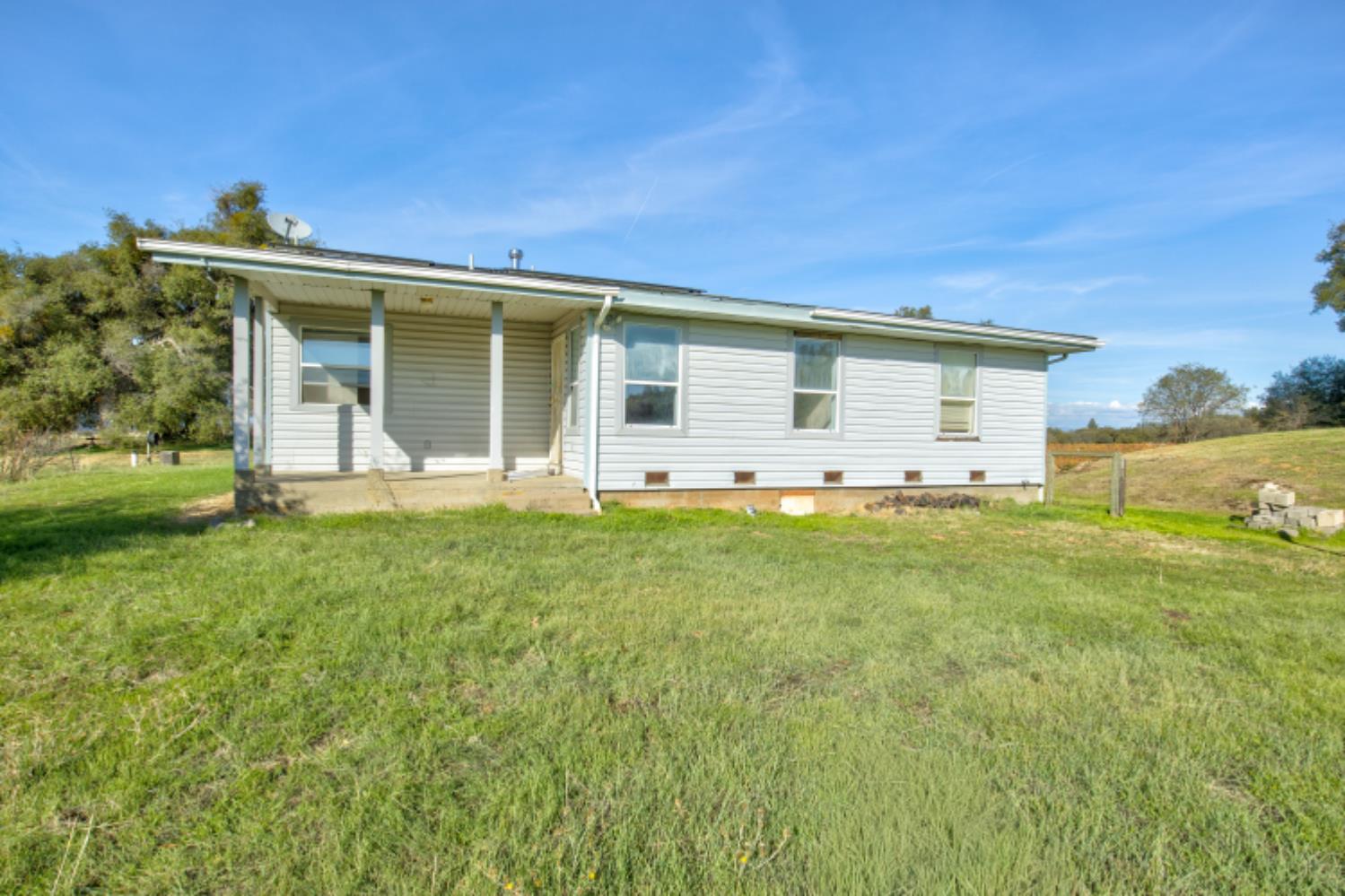 11120 Courier Road Plymouth, CA 95669 - Photo 39 of 73 a front view of house with yard and green space