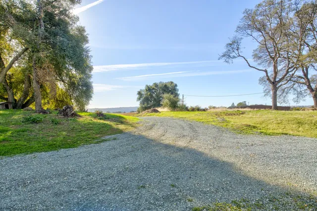 an aerial view of a house with a lake view