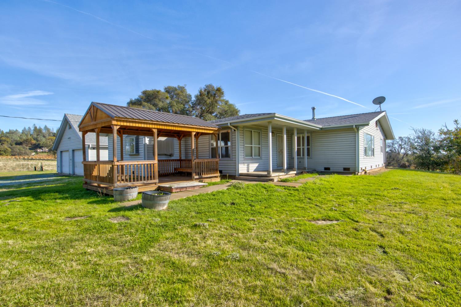 11120 Courier Road Plymouth, CA 95669 - Photo 5 of 73 a view of a house with a yard and sitting area