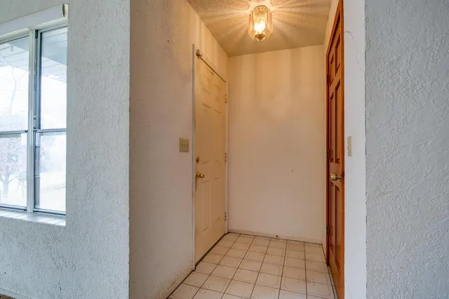 a kitchen with a stove a sink and a refrigerator