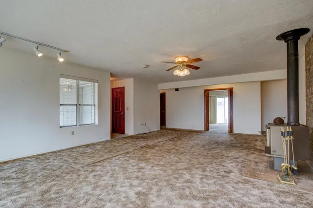a kitchen with a stove and a refrigerator
