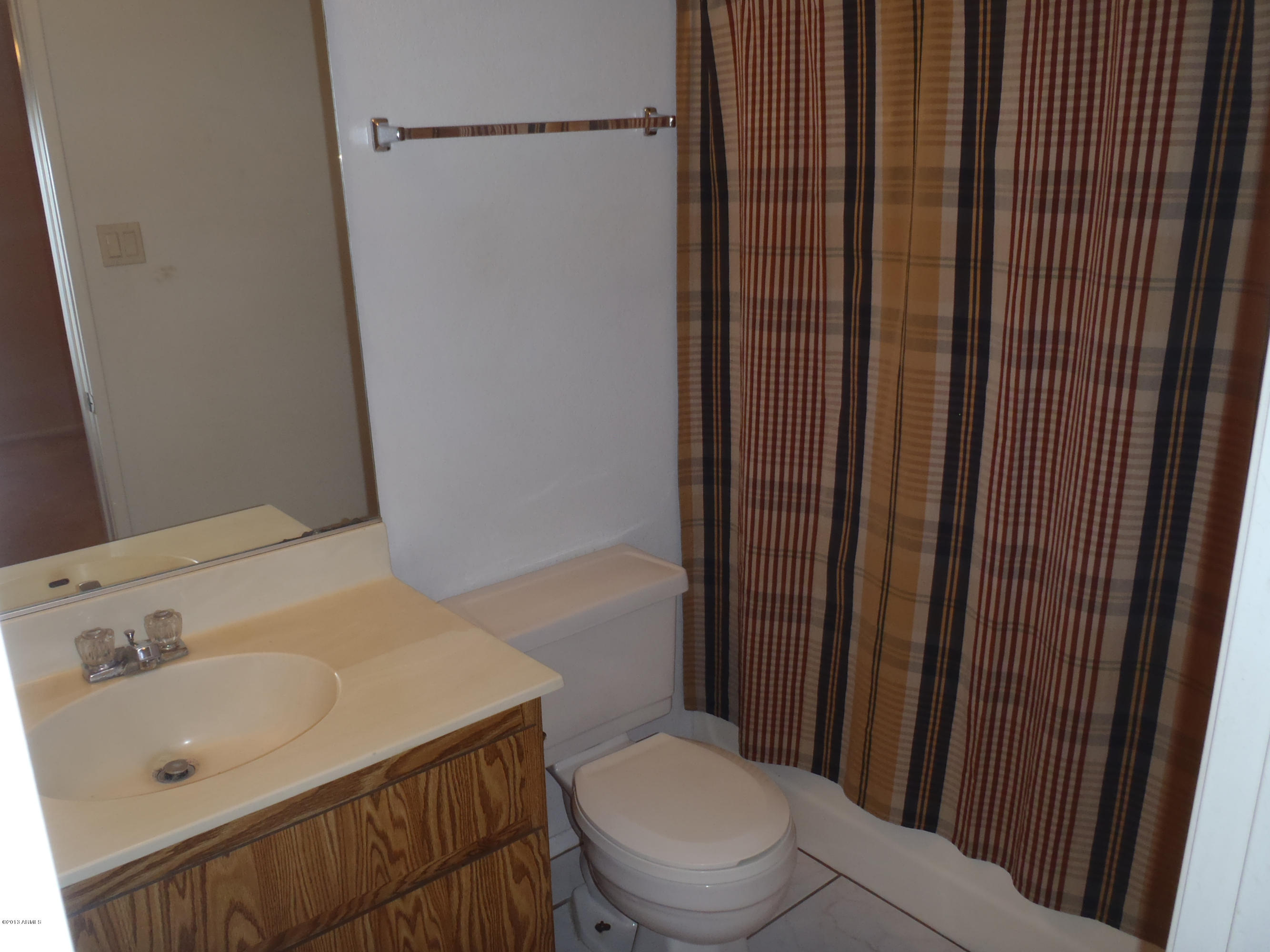 95 North Cooper Road, Unit 45 Chandler, AZ 85225 - Photo 11 of 26 a bathroom with a sink a toilet and shower