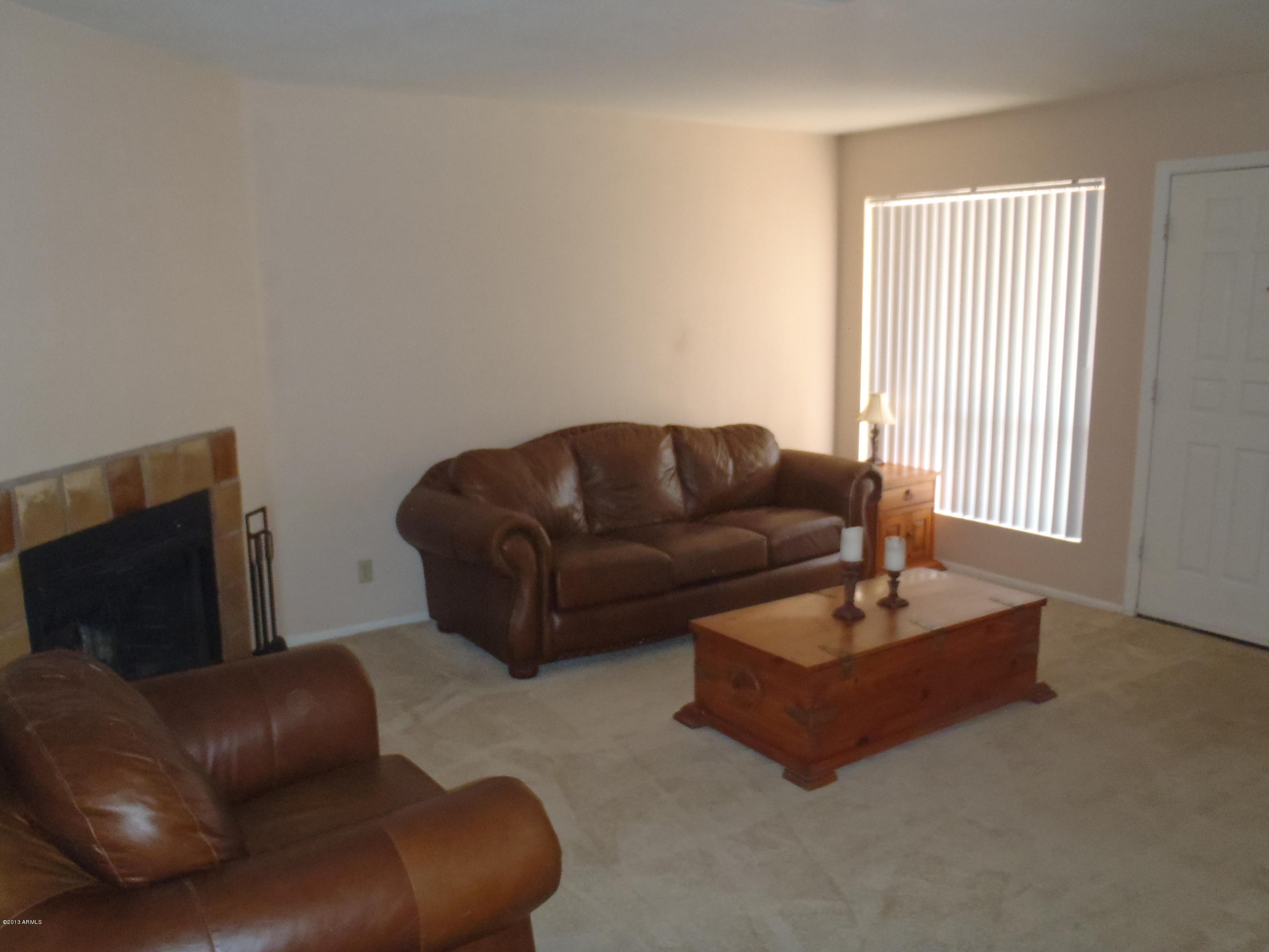 95 North Cooper Road, Unit 45 Chandler, AZ 85225 - Photo 7 of 26 a living room with furniture and a couch