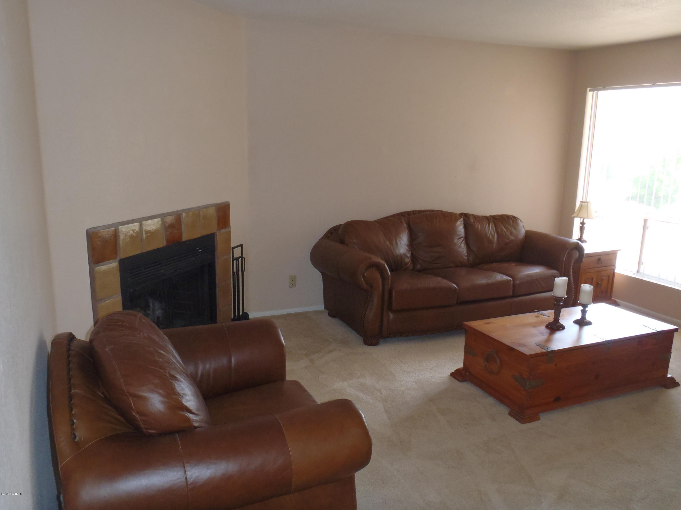 95 North Cooper Road, Unit 45 Chandler, AZ 85225 - Photo 9 of 26 a living room with furniture and a flat screen tv