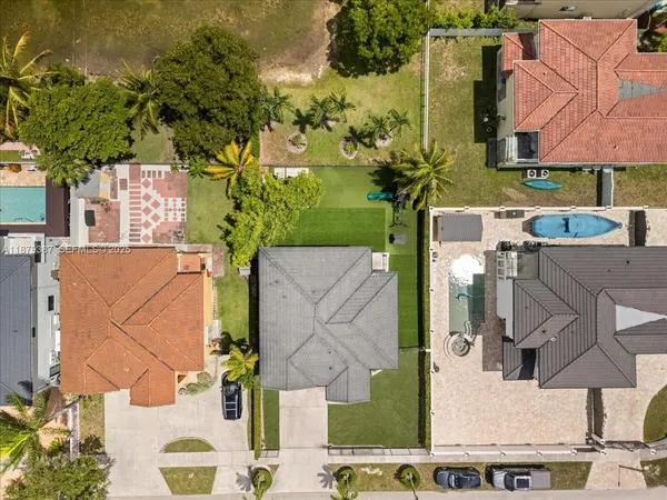 an aerial view of multiple houses with outdoor space