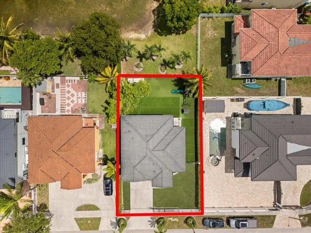 an aerial view of a house with a lake view