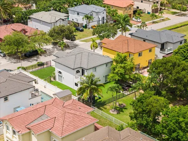 an aerial view of a house with a ocean view