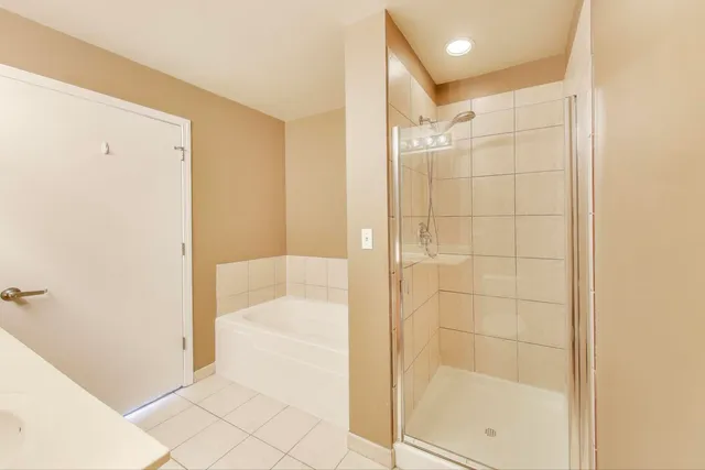 a bathroom with a shower and a sink