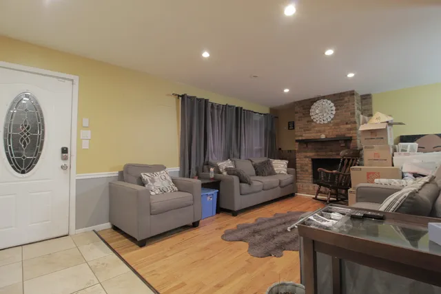 a living room with furniture and a fireplace