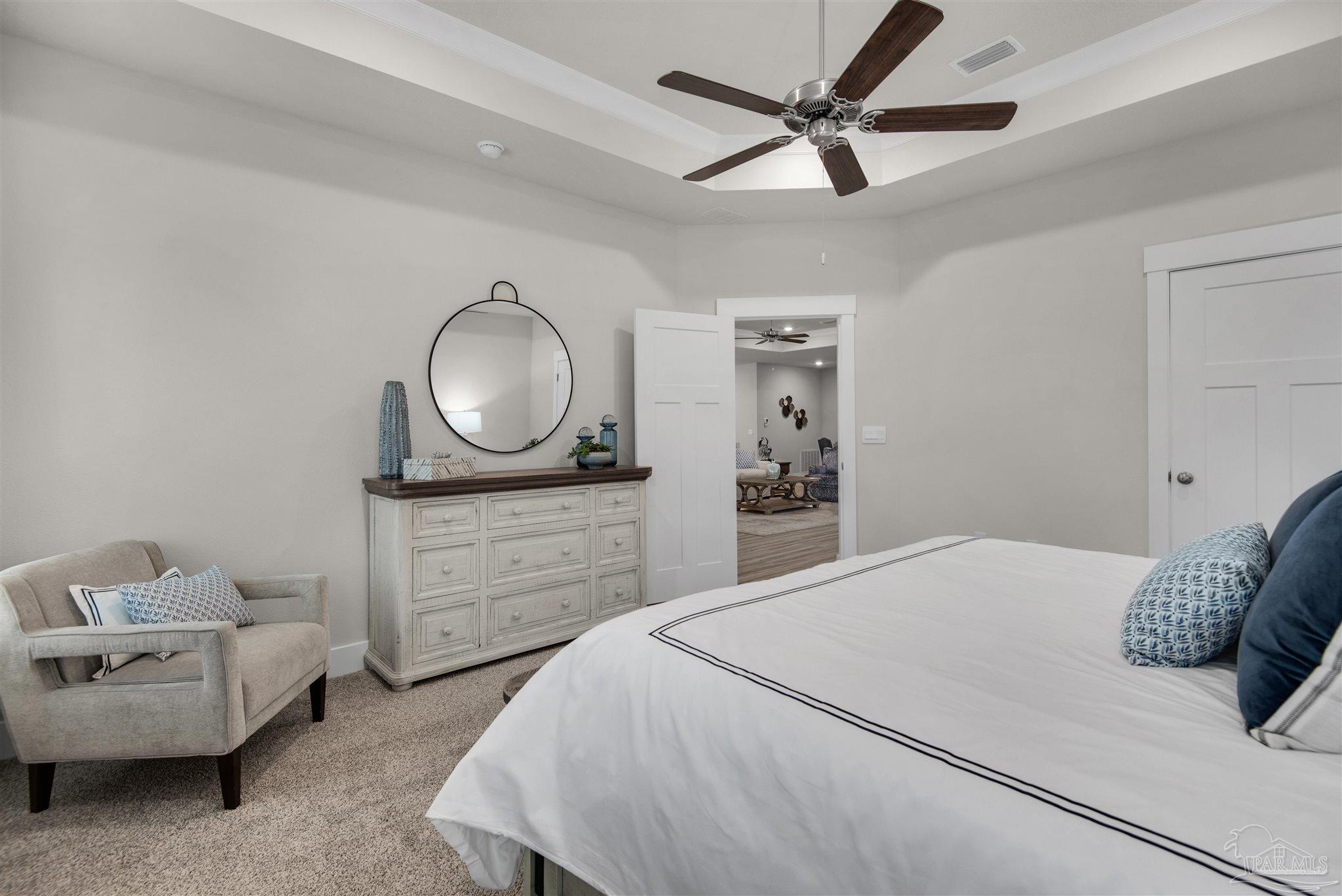 5658 Clarity Street Milton, FL 32570 - Photo 21 of 37 a bedroom with a bed and a couch