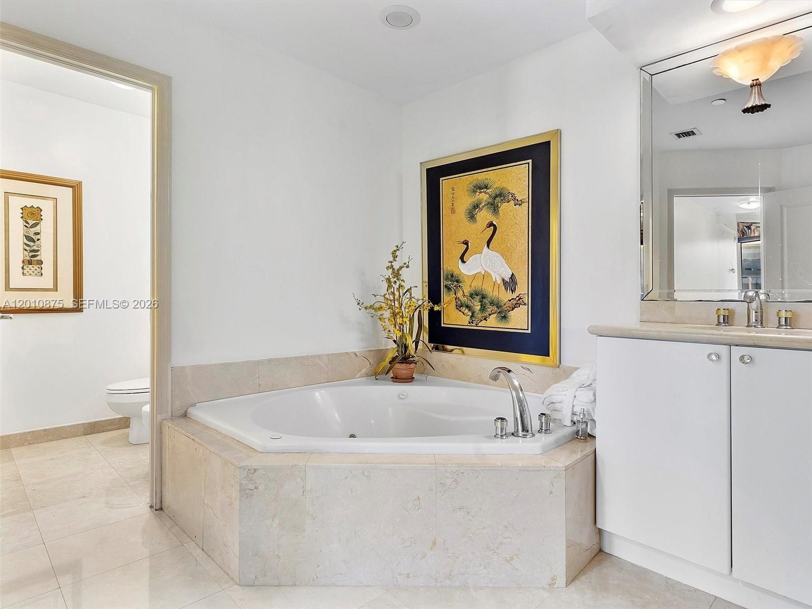 8925 Collins Avenue, Unit 12D Surfside, FL 33154 - Photo 16 of 35 a white bath tub sitting next to a window