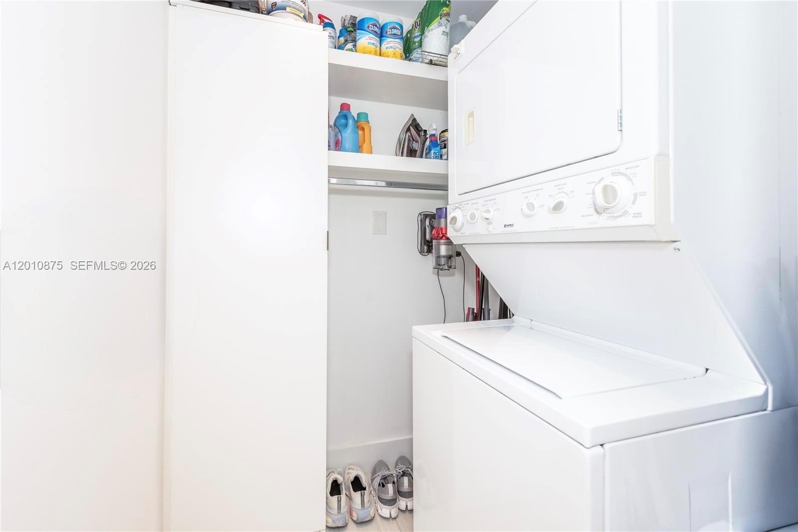 8925 Collins Avenue, Unit 12D Surfside, FL 33154 - Photo 17 of 35 a utility room with dryer and washer