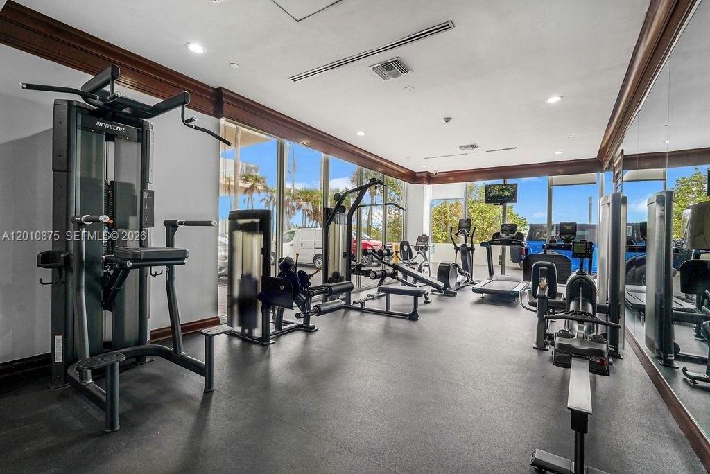 8925 Collins Avenue, Unit 12D Surfside, FL 33154 - Photo 21 of 35 a view of a room with gym equipment