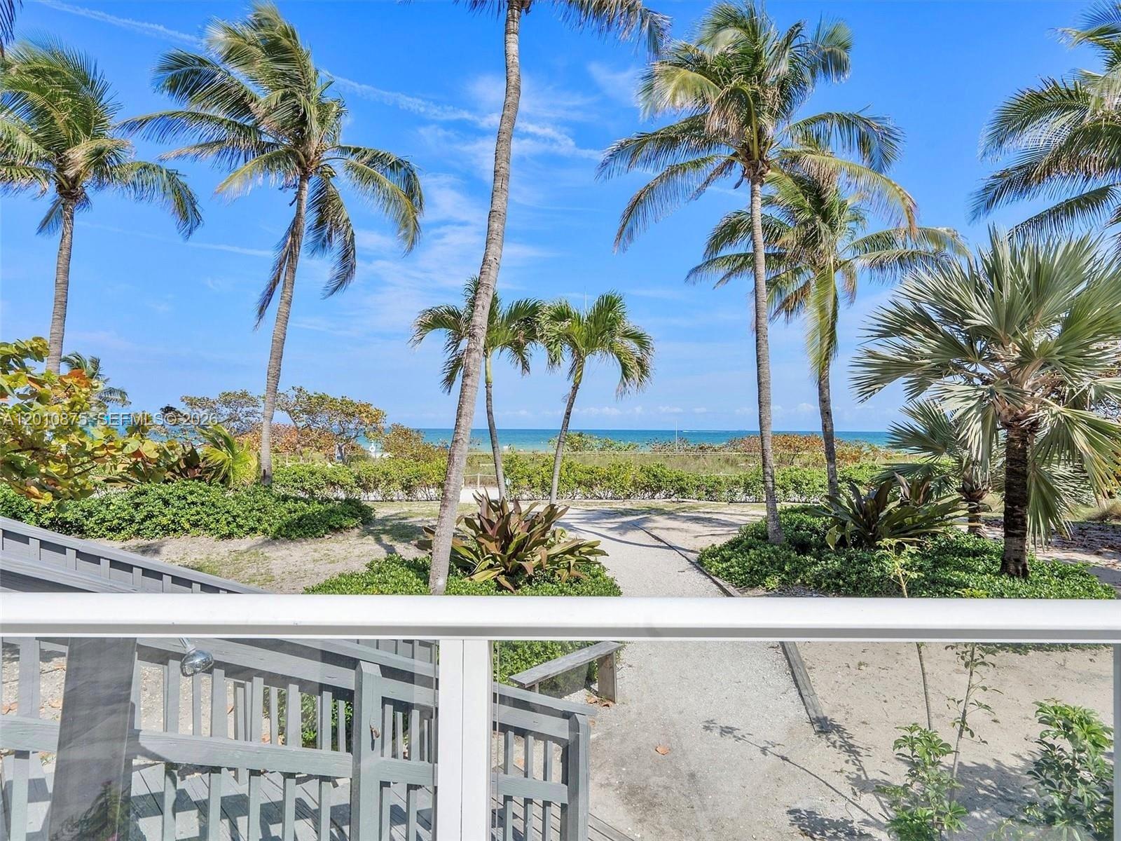 8925 Collins Avenue, Unit 12D Surfside, FL 33154 - Photo 29 of 35 a view of a palm tree with a yard