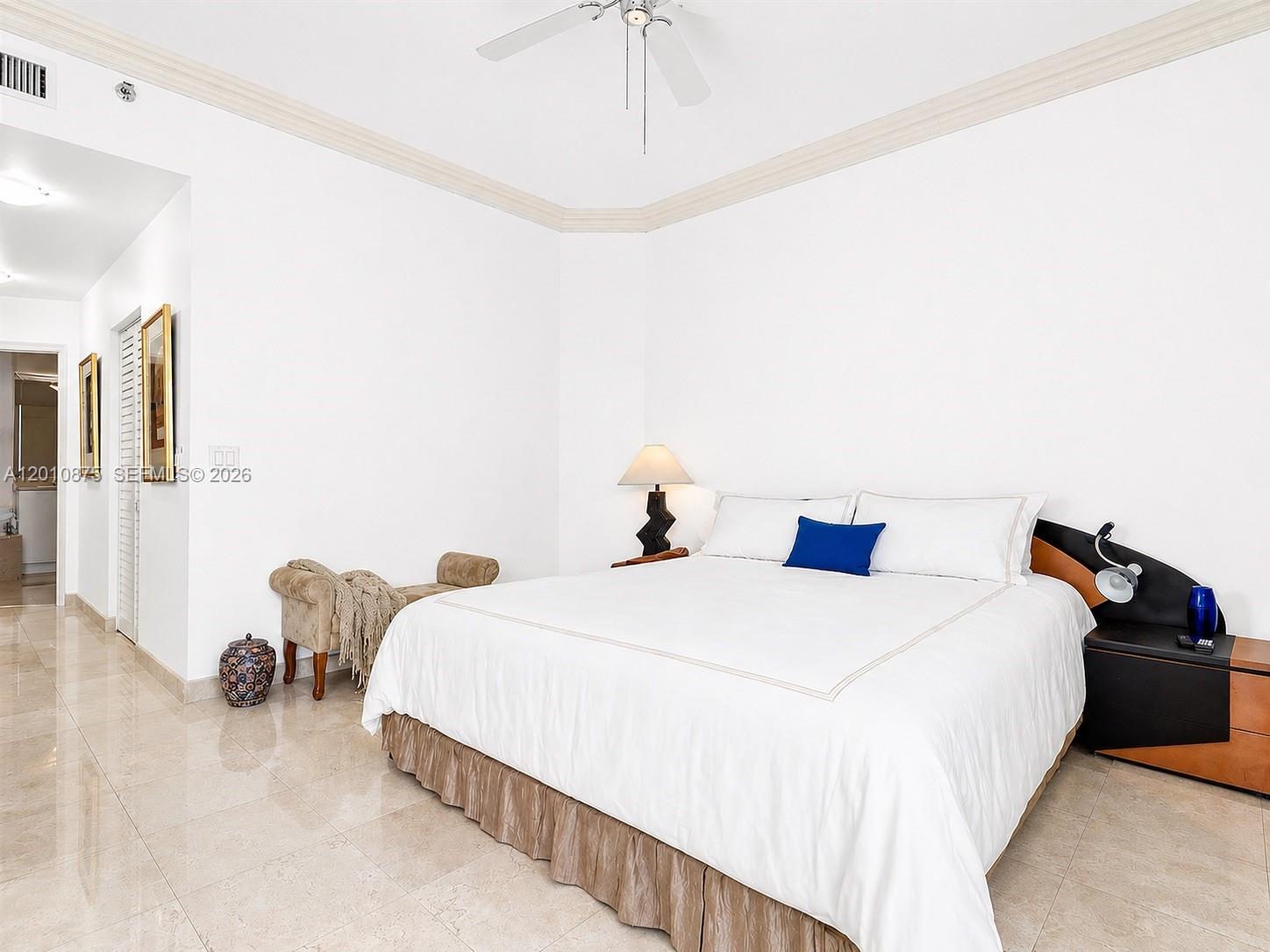8925 Collins Avenue, Unit 12D Surfside, FL 33154 - Photo 8 of 35 a bedroom with a bed and window