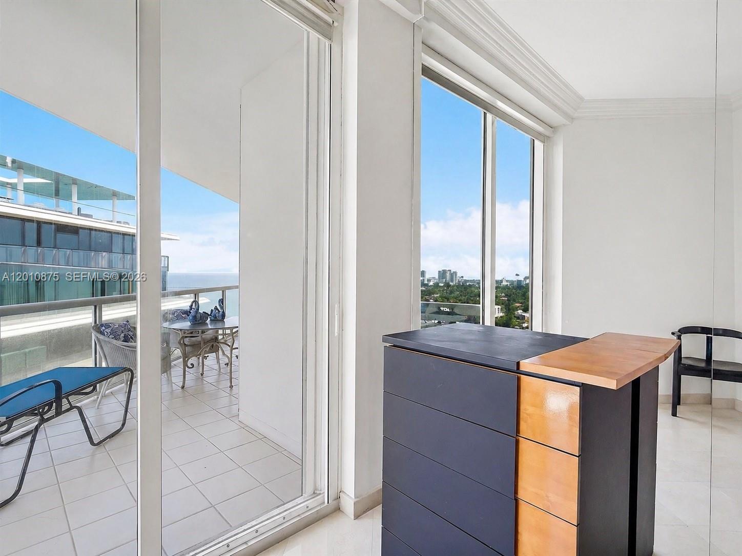 8925 Collins Avenue, Unit 12D Surfside, FL 33154 - Photo 9 of 35 a dining room with a table and chairs