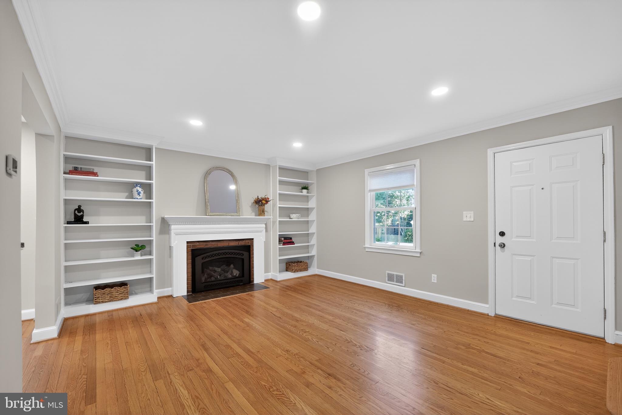 1724 Dublin Drive Silver Spring, MD 20902 - Photo 3 of 55 Living Room w/ Shelving, Mantel and Gas Fireplace
