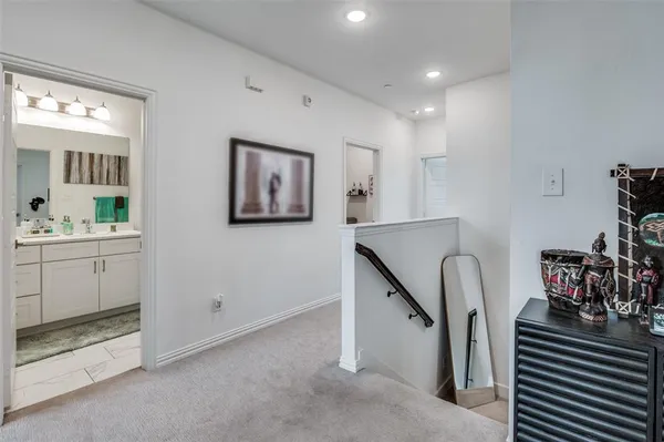 a bedroom with furniture and a flat screen tv