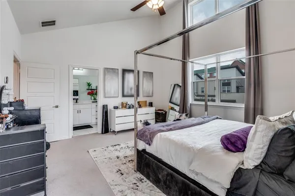 a bathroom with a sink double vanity granite tub shower and a mirror