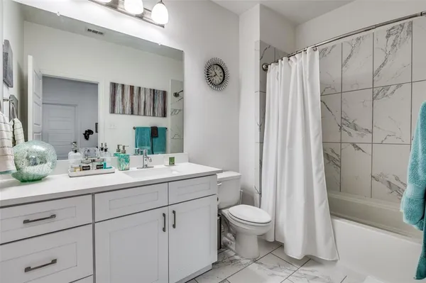 a view of kitchen appliances and cabinets