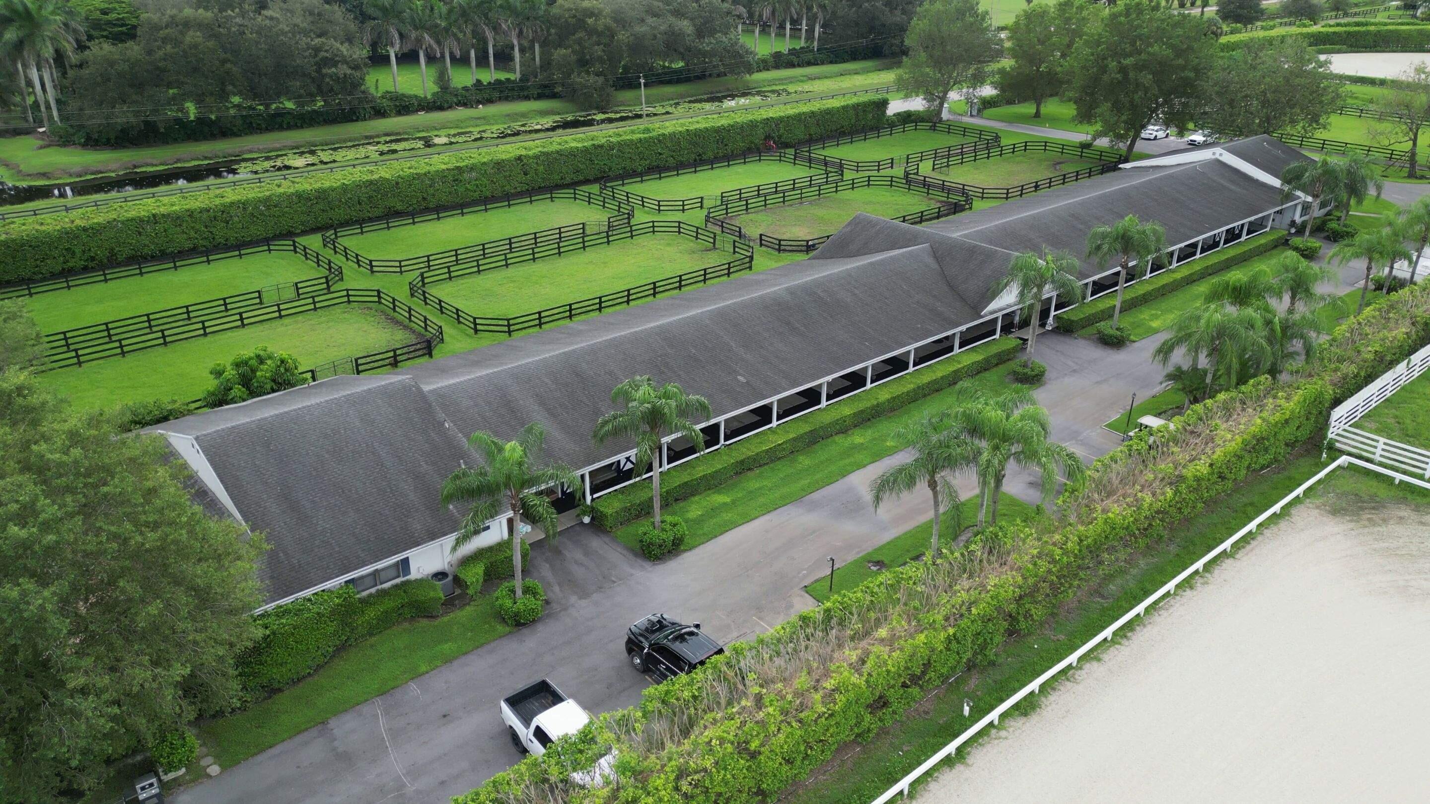 an aerial view of a park with a yard and outdoor seating