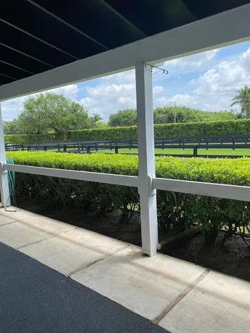 a view of a patio with wooden floor